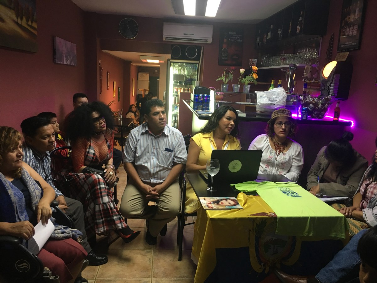 Archival community meeting with migrants in Madrid, 2018; illustrative image, not a U.S. deportation scene